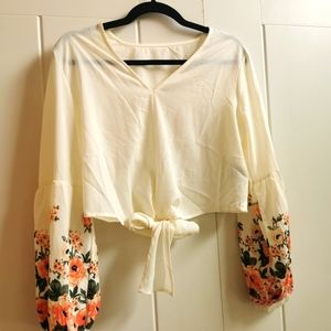 White blouse with floral sleeve details